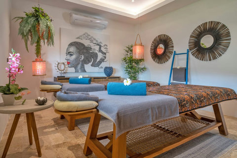 "Unwind in the massage room, filled with the calming scent of lemongrass, ready for sessions with our professional therapist."