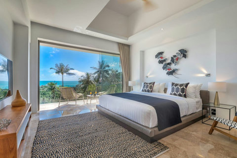 "Awake to serene views of palm trees and the ocean right from your bedroom."