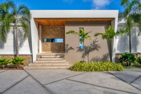 "The inviting entrance of Villa Aruna sets the tone for a luxurious stay."