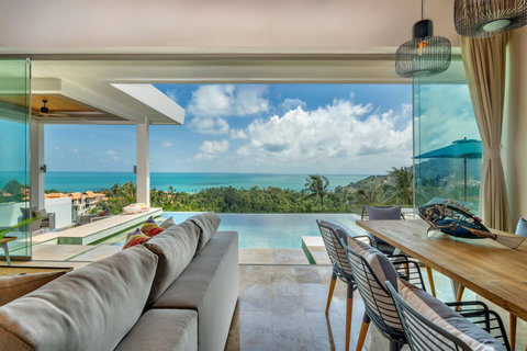 Our spacious living room opens up to mesmerizing panoramic sea views, merging indoor comfort with the beauty of nature."