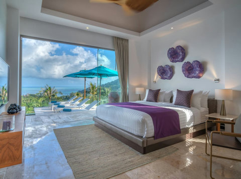 "Wake up in the master bedroom where fine art meets mesmerizing pool and sea views – every day feels like a masterpiece."