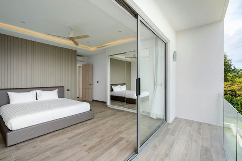 "Balcony views through sliding windows offer a snapshot of paradise."