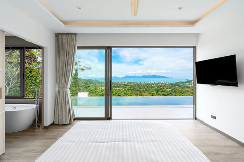 "Chic comfort meets style in this plush bedroom."