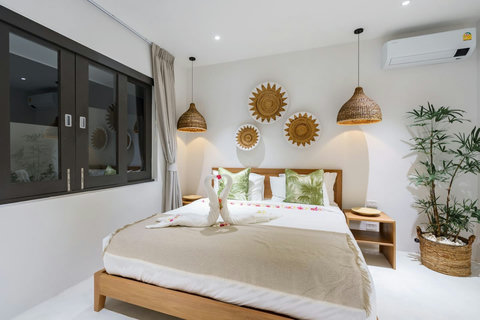 Bohemian-style bedroom with decorative pendant lights