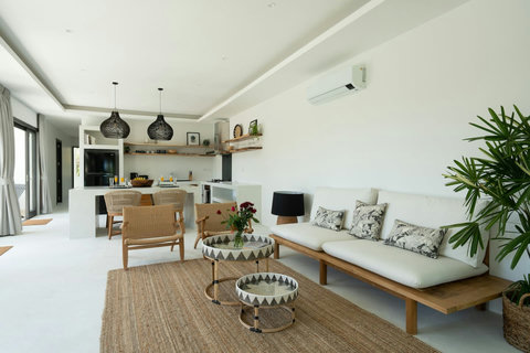 Outdoor covered terrace with traditional decor and garden views