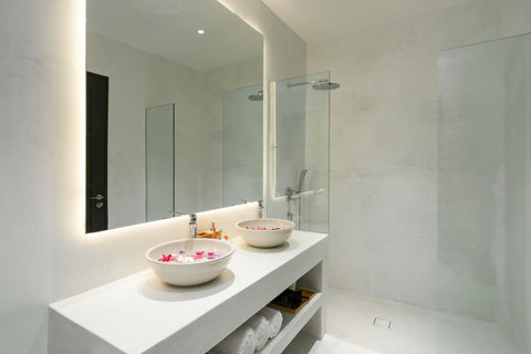 Spa-inspired bathroom with flower petal accents