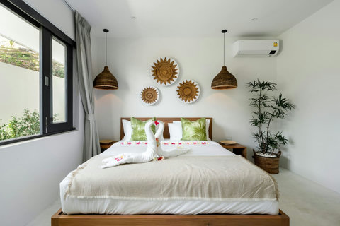 Serene bedroom with neutral tones and premium bedding