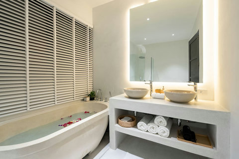 Spacious bathroom with double vanity and large mirror