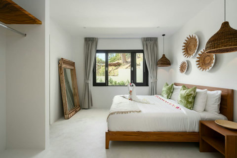 Bedroom with decorative mirror art and warm ambient lighting