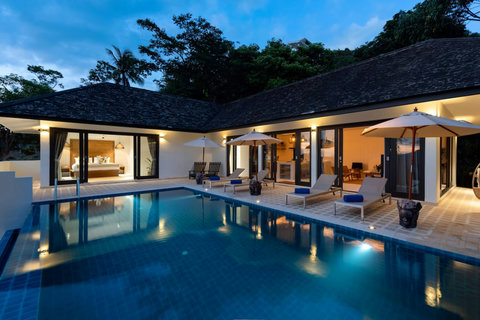 Private pool at twilight with atmospheric blue lighting