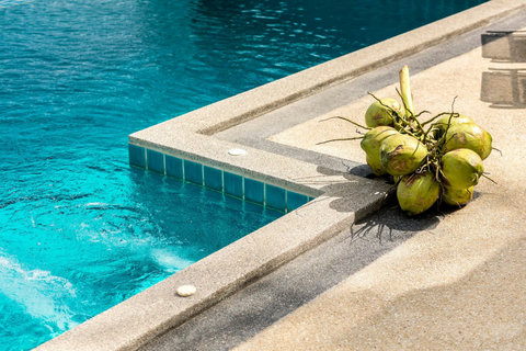 Pool edge detail with fresh tropical touches - perfect for poolside refreshments in paradise