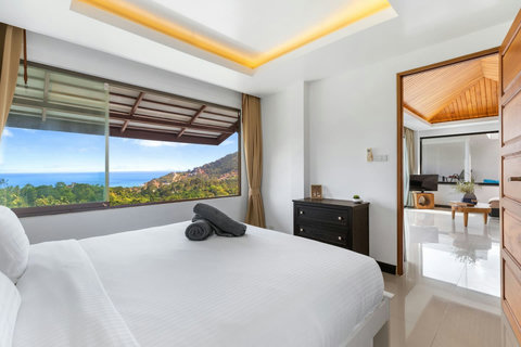 Spacious bedroom with en-suite bathroom, sea views and elegant Asian-inspired decor - all 4 bedrooms feature private bathrooms