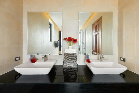 Stunning master bathroom with dual freestanding bathtubs and elegant contemporary design