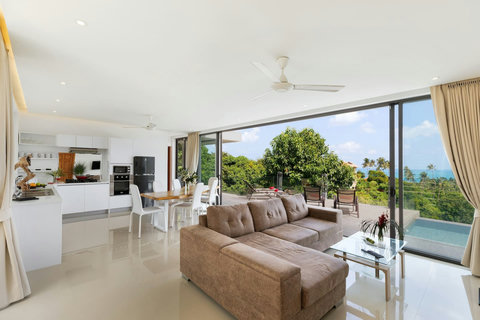 Spacious open-plan dining and living area with pool access - ideal for entertaining and relaxation