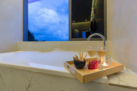 Relaxing jacuzzi with evening ambiance and refreshments - perfect for unwinding after exploring Koh Samui
