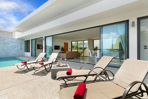 Sun-drenched pool terrace with multiple loungers - your private outdoor sanctuary in exclusive Viewpoint Hillside
