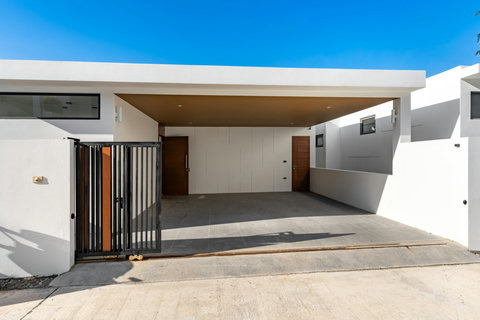 Grand villa entrance with contemporary design, decorative screening and elegant architecture - impressive arrival