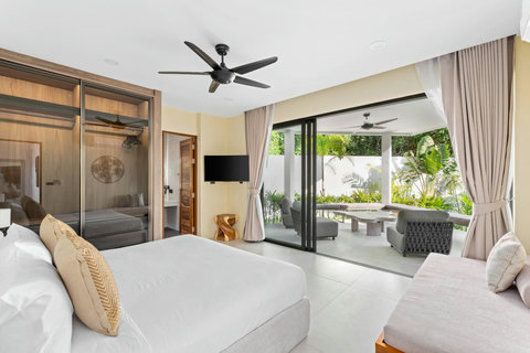 Bright bedroom with bunk area, terrace doors and tropical indoor-outdoor flow - perfect for families with children