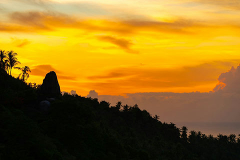 Spectacular golden sunset over Koh Samui hills and ocean - breathtaking tropical island evening views