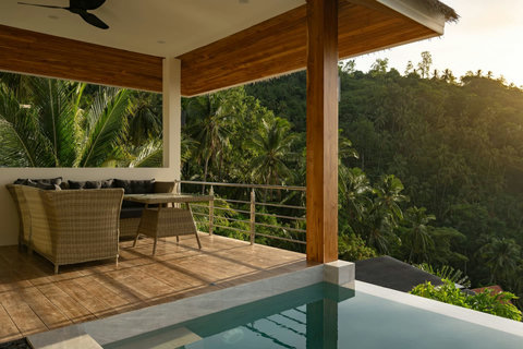 Peaceful covered sala terrace with hillside jungle views - Sunrise Hill villa outdoor relaxation space