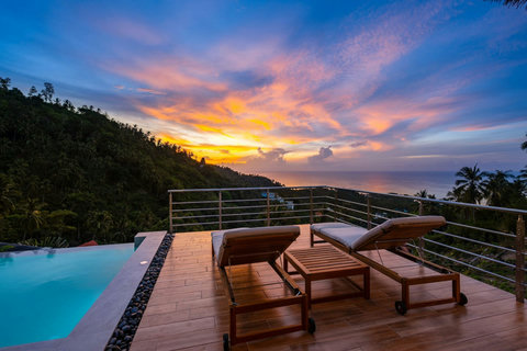Infinity pool deck with sunset lounge area - luxury hillside villa Koh Samui with breathtaking sea panoramas