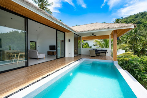 Pool deck with sala and tropical garden surroundings - luxury infinity pool villa Koh Samui