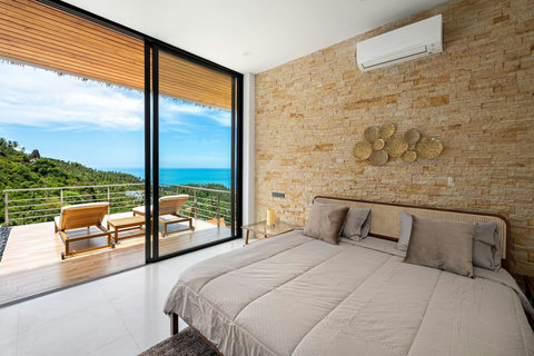 Bright bedroom with panoramic ocean and island views, terrace doors - luxury master suite Koh Samui