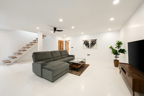 Private parking and villa entrance at twilight - secure and convenient access to your Sunrise Hill retreat