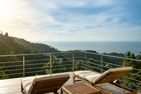 Relaxing rooftop loungers with breathtaking coastal and jungle views - premium outdoor relaxation space
