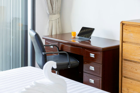 Work desk with ergonomic chair and tablet, ideal for remote work at Villa Yoco, Koh Samui