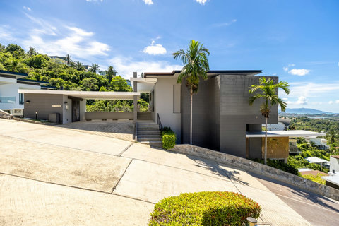Contemporary villa exterior with driveway, palms and sea views at Villa Yoco, Koh Samui