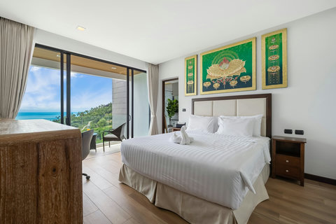Bright king bedroom with artwork and sea-view balcony at Villa Yoco Koh Samui