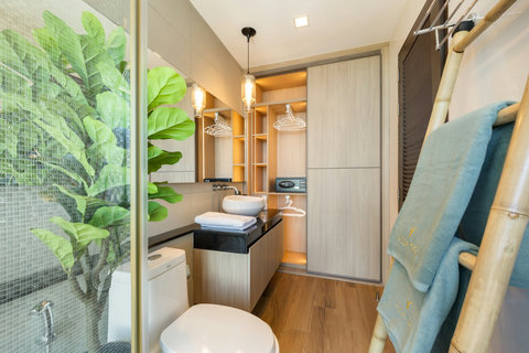 En-suite bathroom with pendant lighting and tropical accents at Villa Yoco Koh Samui
