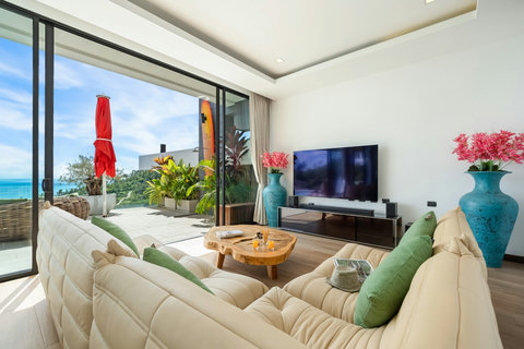 Spacious living room with sea-view terrace and smart TV at Villa Yoco Koh Samui