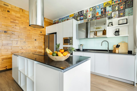 Fully equipped modern kitchen with island and feature wall at Villa Yoco Koh Samui