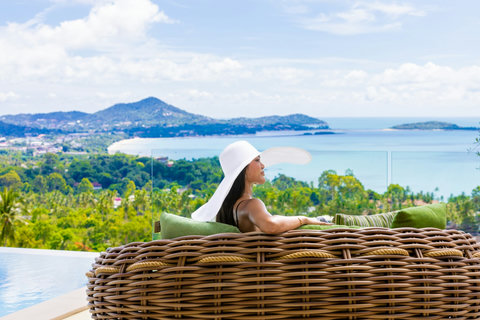 Guest relaxing on a daybed with panoramic sea views at Villa Yoco, Koh Samui