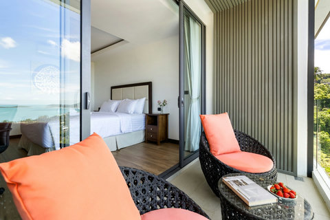 Private balcony seating with sea views off the bedroom at Villa Yoco, Koh Samui