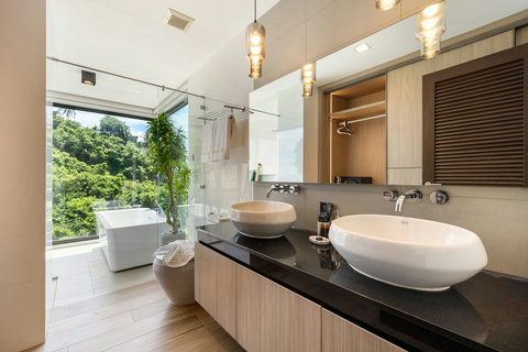 Spa-style bathroom with double vanity, soaking tub and garden views at Villa Yoco, Koh Samui