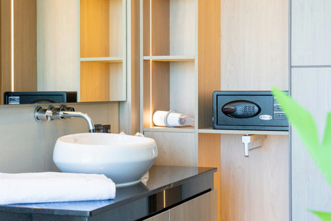 Bathroom with vessel sink, shelving and in-room safe at Villa Yoco, Koh Samui