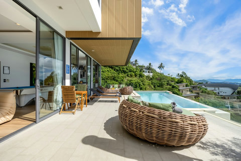 Poolside daybed on terrace with sea and island views at Villa Yoco Koh Samui