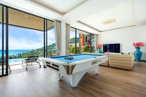 Games room with pool table, TV and sea-view windows at Villa Yoco, Koh Samui