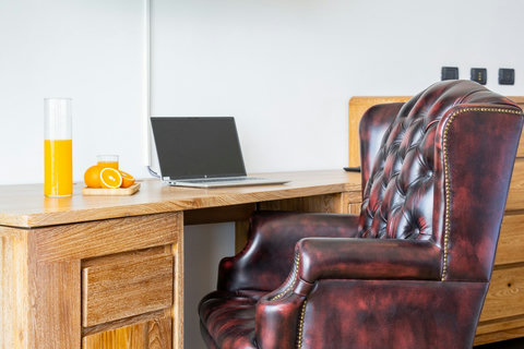 Work desk with laptop and leather armchair, ideal for remote work at Villa Yoco, Koh Samui
