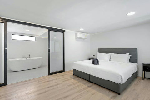 Bright ensuite bathroom with vanity at C'est la Vie, Replay Residence Koh Samui