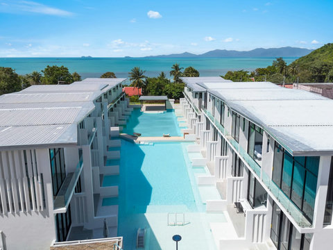 Aerial view of shared pool and sun loungers at Replay Residence, Koh Samui vacation rental