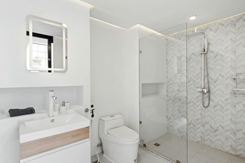 Modern bathroom with rain shower at C'est la Vie, Replay Residence Koh Samui
