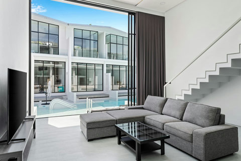 Spacious living room with sofa at C'est la Vie, Replay Residence Koh Samui