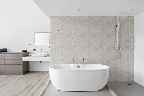 Spa-inspired bathroom with soaking tub at C'est la Vie, Replay Residence Koh Samui