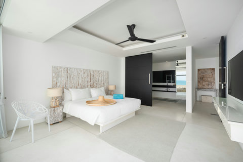 Spacious white interior with split-level design and natural light in Koh Samui holiday villa