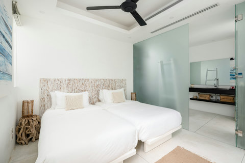 Elegant entrance hallway with curated artwork and modern decor at Villa Ocean Serenity Thailand