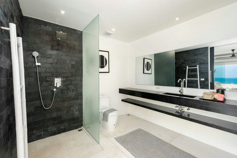 Modern walk-in shower bathroom with glass enclosure and premium finishes, Villa Ocean Serenity